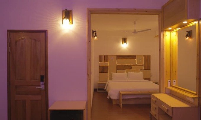 Guest room interior with wooden door